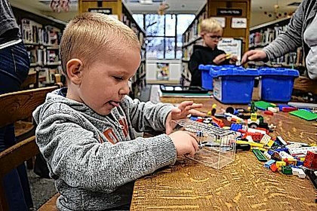 Emmett Murray, 4, and Dean Haley, 6, build contraptions out of Lego Friday at the Jacksonville Public Library Lego Club. The Lego Club meets on the second Friday of each month from 2:30 to 4:30 p.m. Kids are invited to stop in and join in the Lego fun.