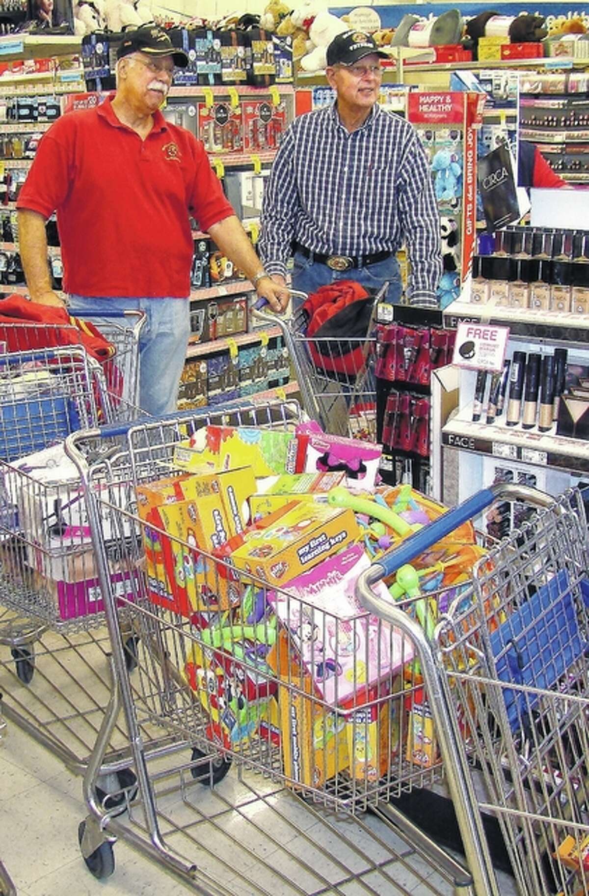 Roger Deem | Journal-Courier By the end of the shopping trip, members of the West Central Illinois Leathernecks of the Marine Corps League have collected several shopping carts filled with toys to add to those donated for the Toys for Tots campaign.