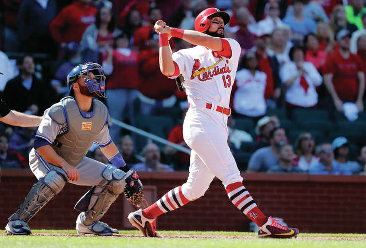 The Cardinals’ Matt Carpenter (right) and Blues Jays catcher Russell Martin watch Carpenter’s grand slam in the 11th inning beat the Jays in the first baseball of a doubleheader Thursday at Busch Stadium.