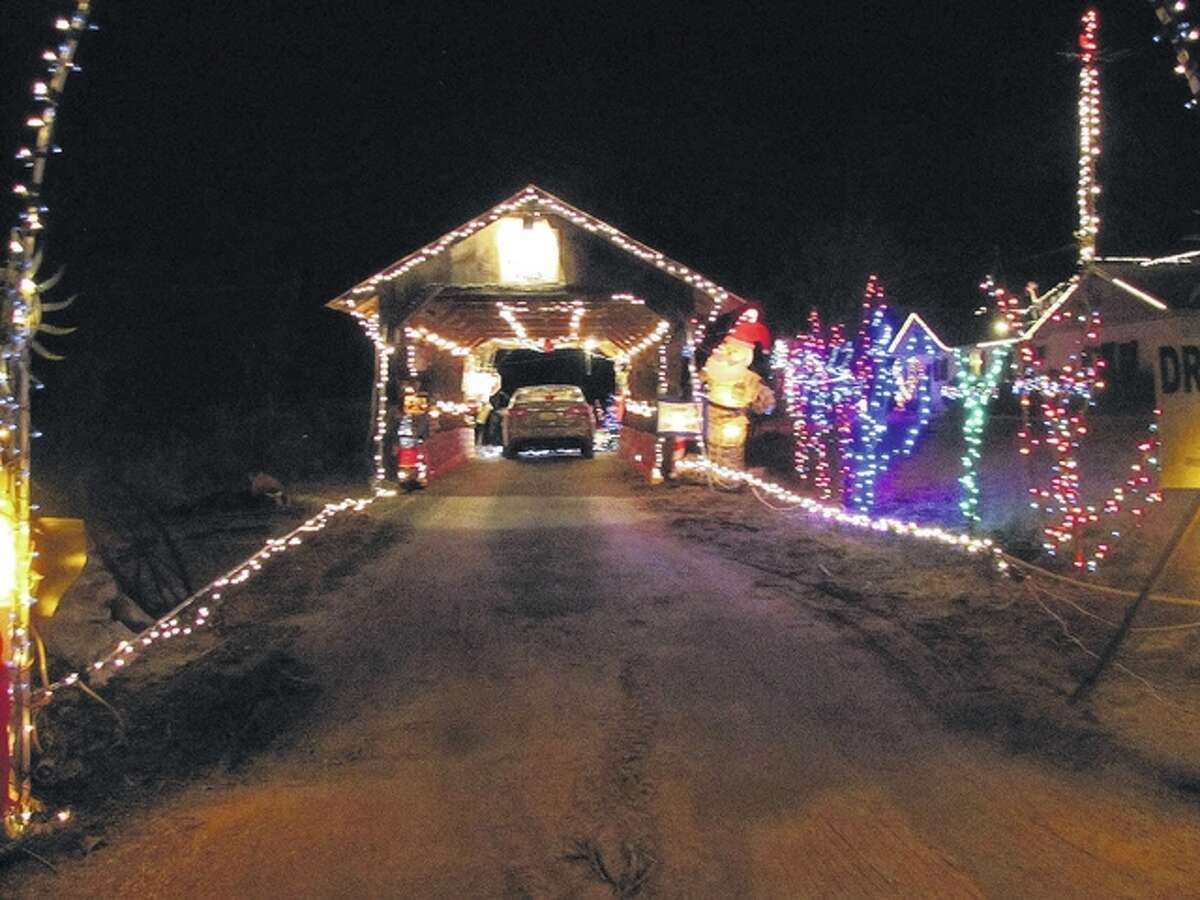 Gary Coates | Reader photo The covered bridge at Haypress Falls is decked out for Christmas.