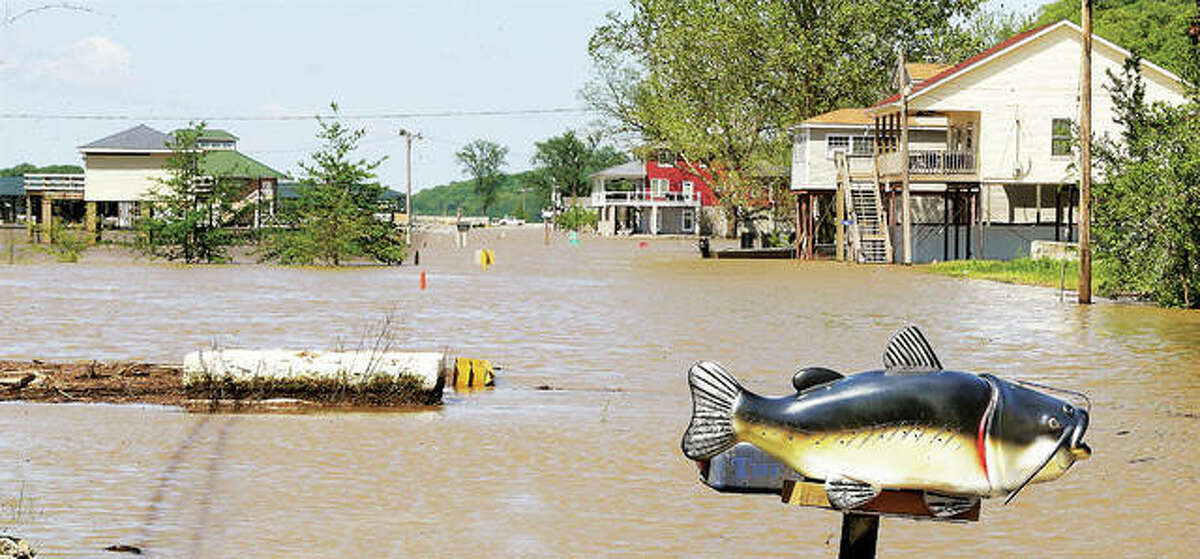 The fish were not jumping out of the water on Water Street in Grafton Tuesday, but it did seem appropriate for one resident to have a fish mailbox as floodwaters continue to rise in Grafton. Main Street through town is flooded in several places, and police are stopping motorists from driving through the high waters.