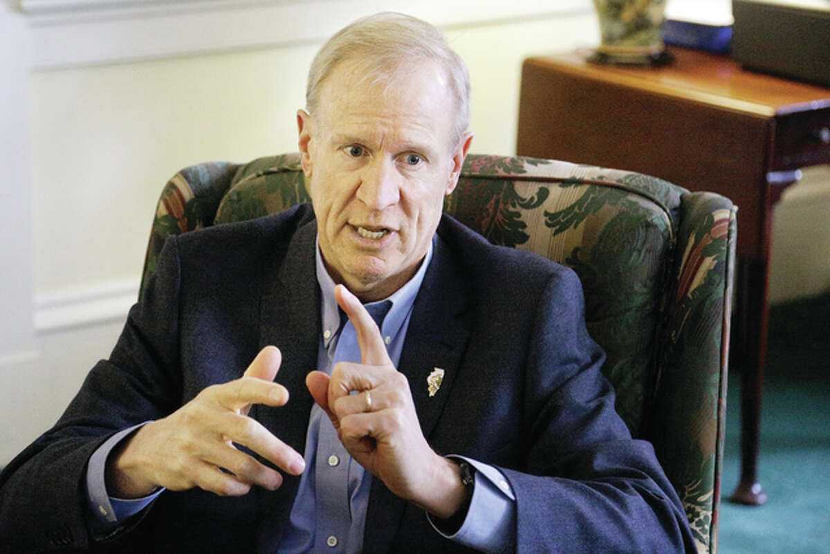 Illinois Gov. Bruce Rauner talks Monday to the Associated Press at the Executive Mansion in Springfield, discussing the year behind and the year ahead for Illinios on the eve of the one-year anniversary of his taking office.