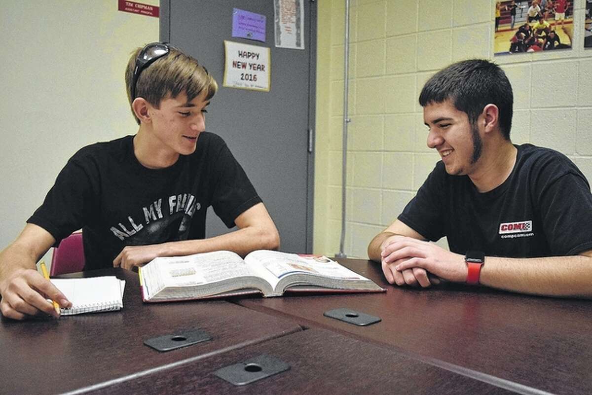 Nick Rentschler of Jacksonville helps Andrew Sipes of Jacksonville with homework, one of the things students can do during The Great Kindness Challege.