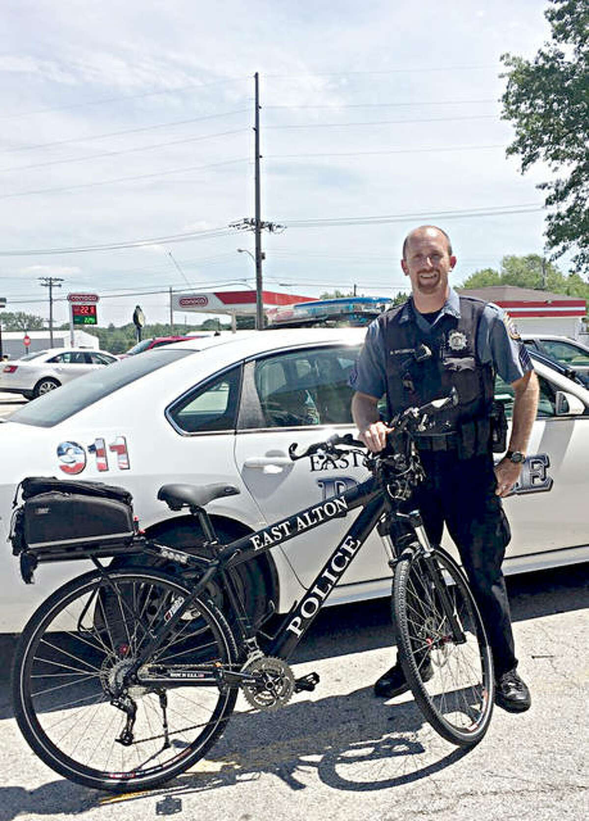 East Alton Police Sgt. Michael McCormick with the department’s new bike, which was recently donated by Madison County Transit.