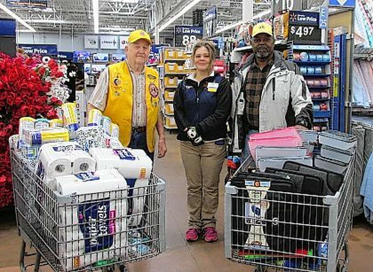 Jacksonville Lions Club President Jimmie Barber (left) received a call from School District 117 and was given a list of school supplies that were needed. Barber with the assistance of Lion Vice President Aaron Singleton (right) and Walmart Department manager Jeaneen Dumdie (center) helped gather the supplies. The Lions thank Walmart and the people of Jacksonville and the surrounding communities for their generous donations during the club’s school supply fundraiser.