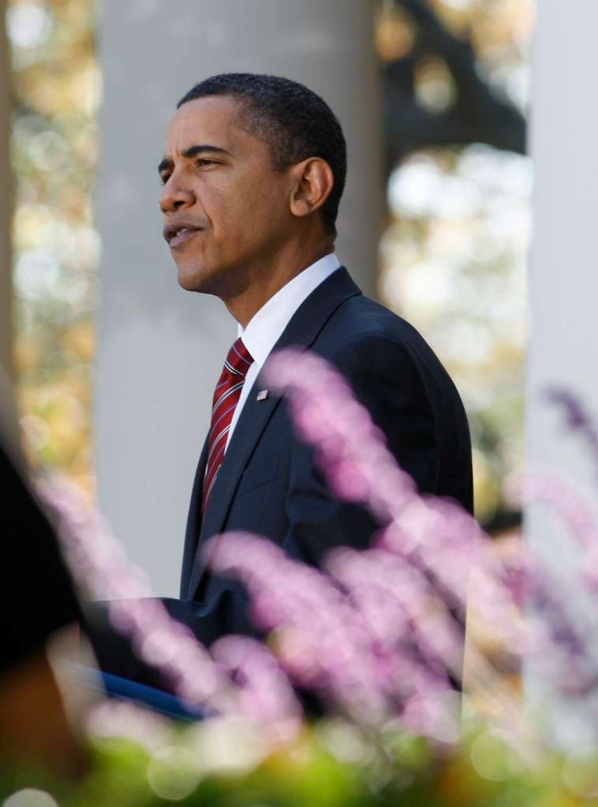 President Barack Obama speaks in the Rose Garden of the White House about health care reform and Iraq's new electoral law after returning from Camp David Sunday, Nov. 8, 2009, in Washington. (Ron Edmonds / Associated Press)