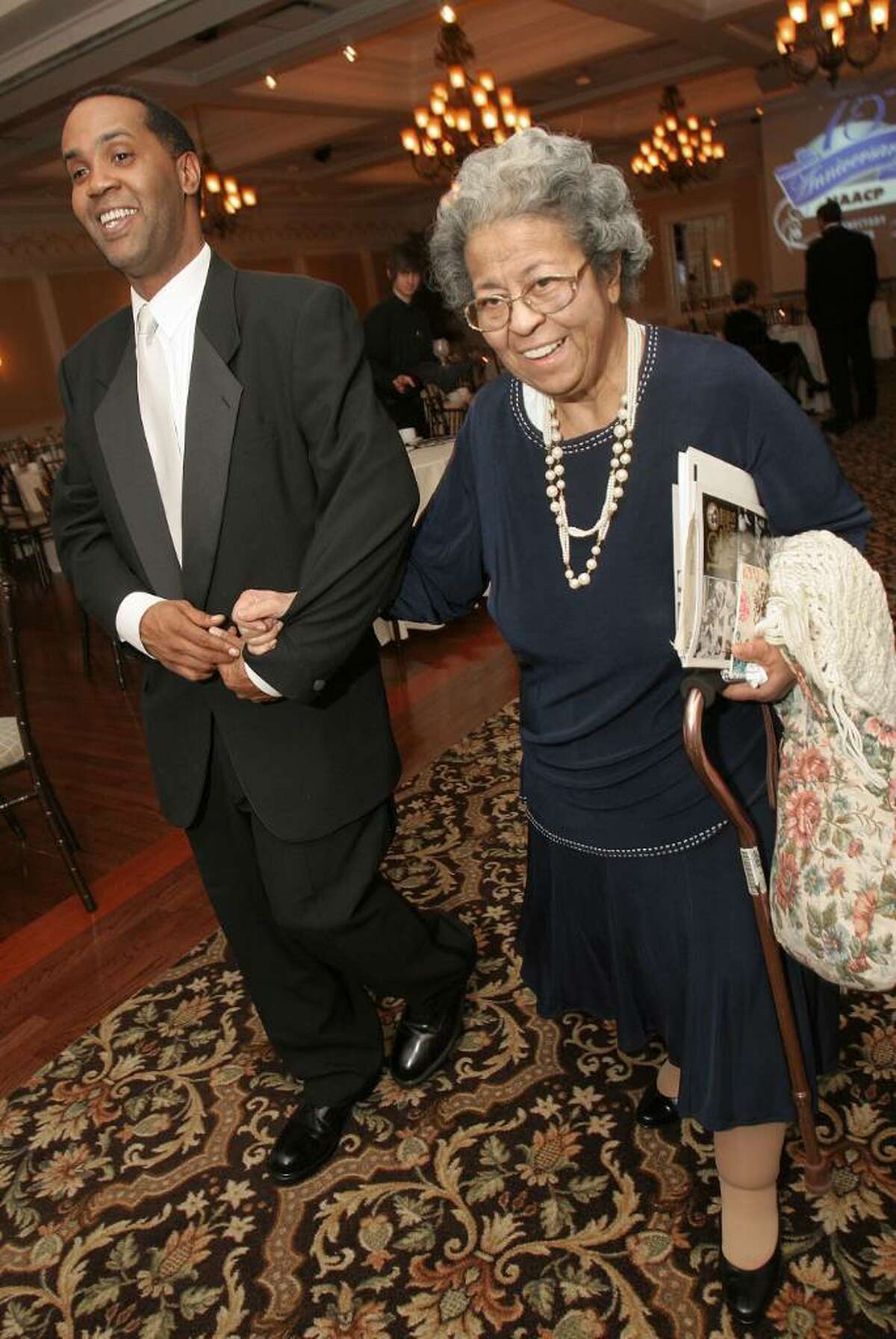 Freedom Fund Committee Chairman Tony Gaddy escorts Schenectady activist and the first female president of the Schenectady NAACP(1959-1964) Malinda Meyers at the Freedom Fund Dinner, which celebrated the 75th anniversary of the NAACP Schenectady Branch. (Joe Putrock / Special to the Times Union)