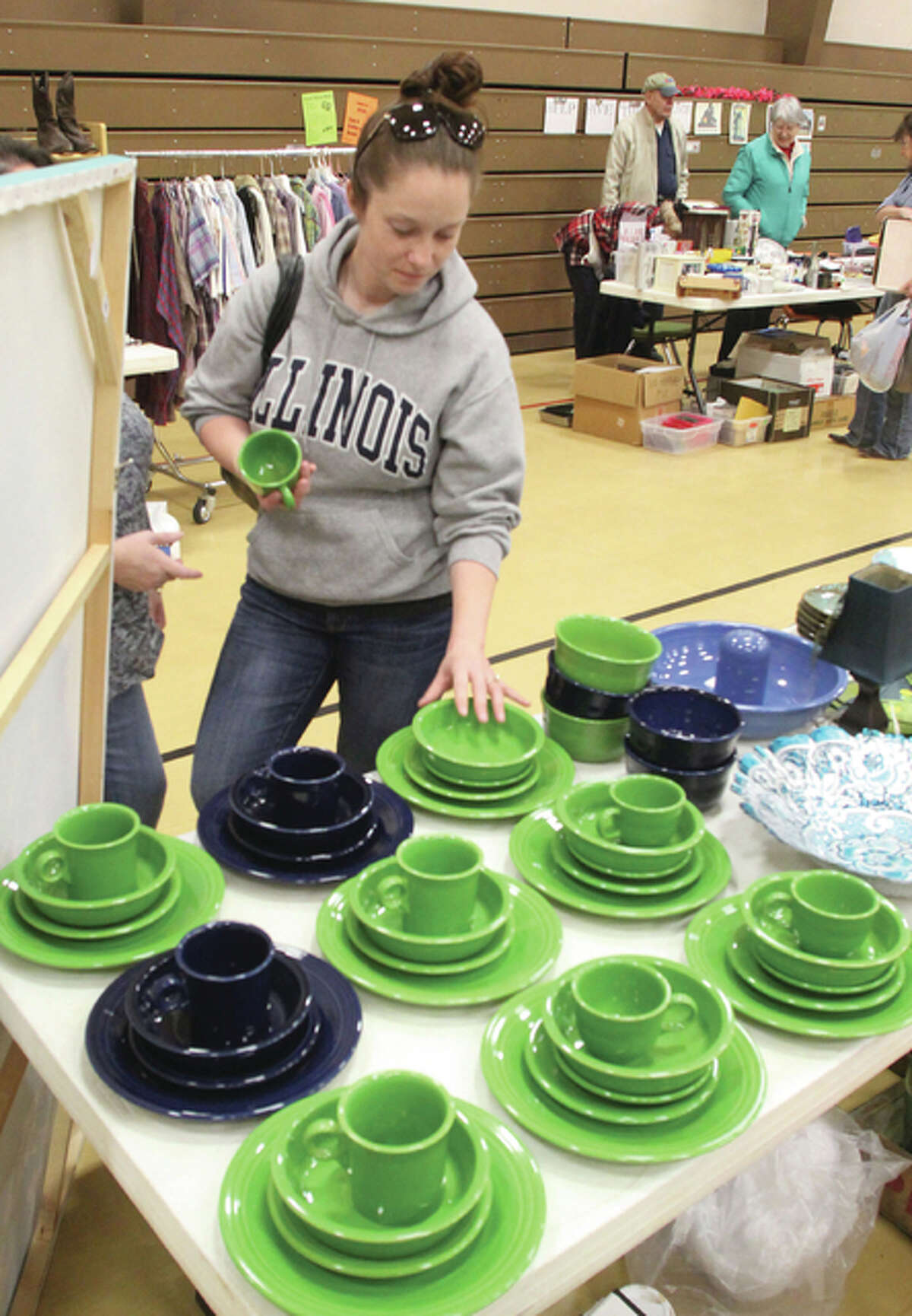 Jerseyville resident Heather Ward looks at dishes at the third Annual Jerseyville Parks and Recreation Department rummage sale, held Saturday. She and her mother Susan Robertson decided to drop by while out grocery shopping.