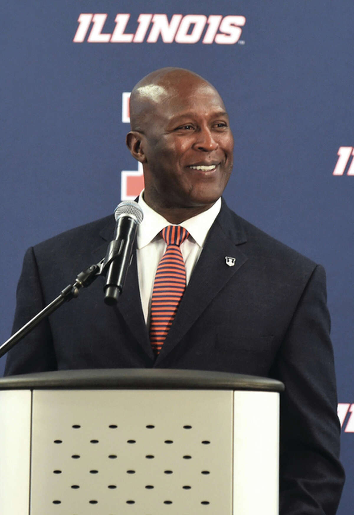 Lovie Smith addresses the mediia at the news conference introducing Smith as Illinois’ new football coach Monday in Champaign.