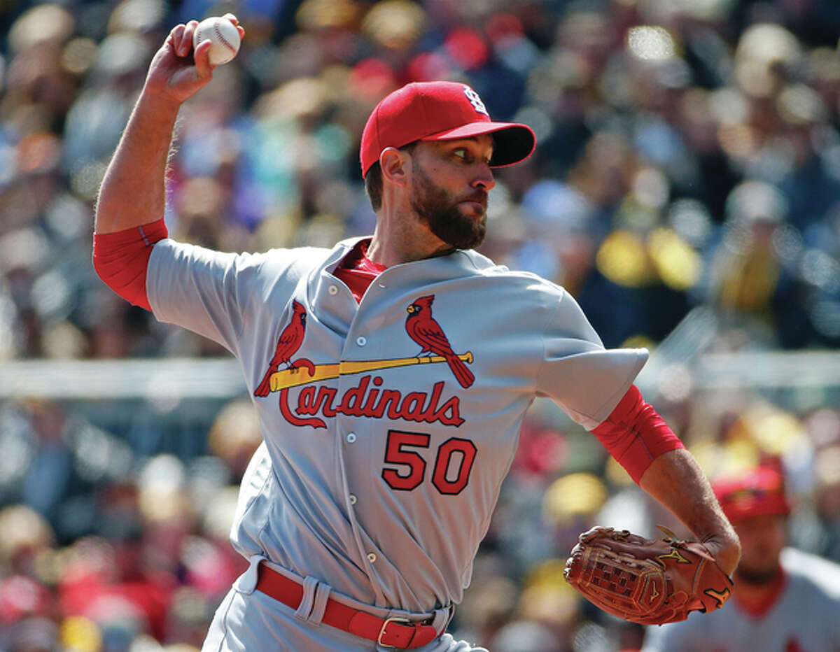 Cardinals starting pitcher Adam Wainwright works during the first inning of the their game on opening day against the Pirates on Sunday in Pittsburgh.