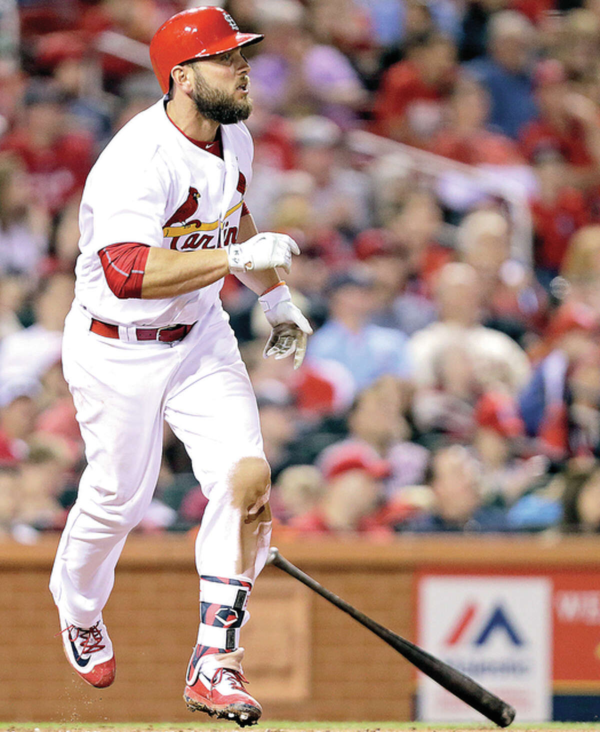 The Cardinals’ Matt Holliday watches his home run, his second of the game, in the sixth inning Friday night against the Cincinnati Reds at Busch Stadium.