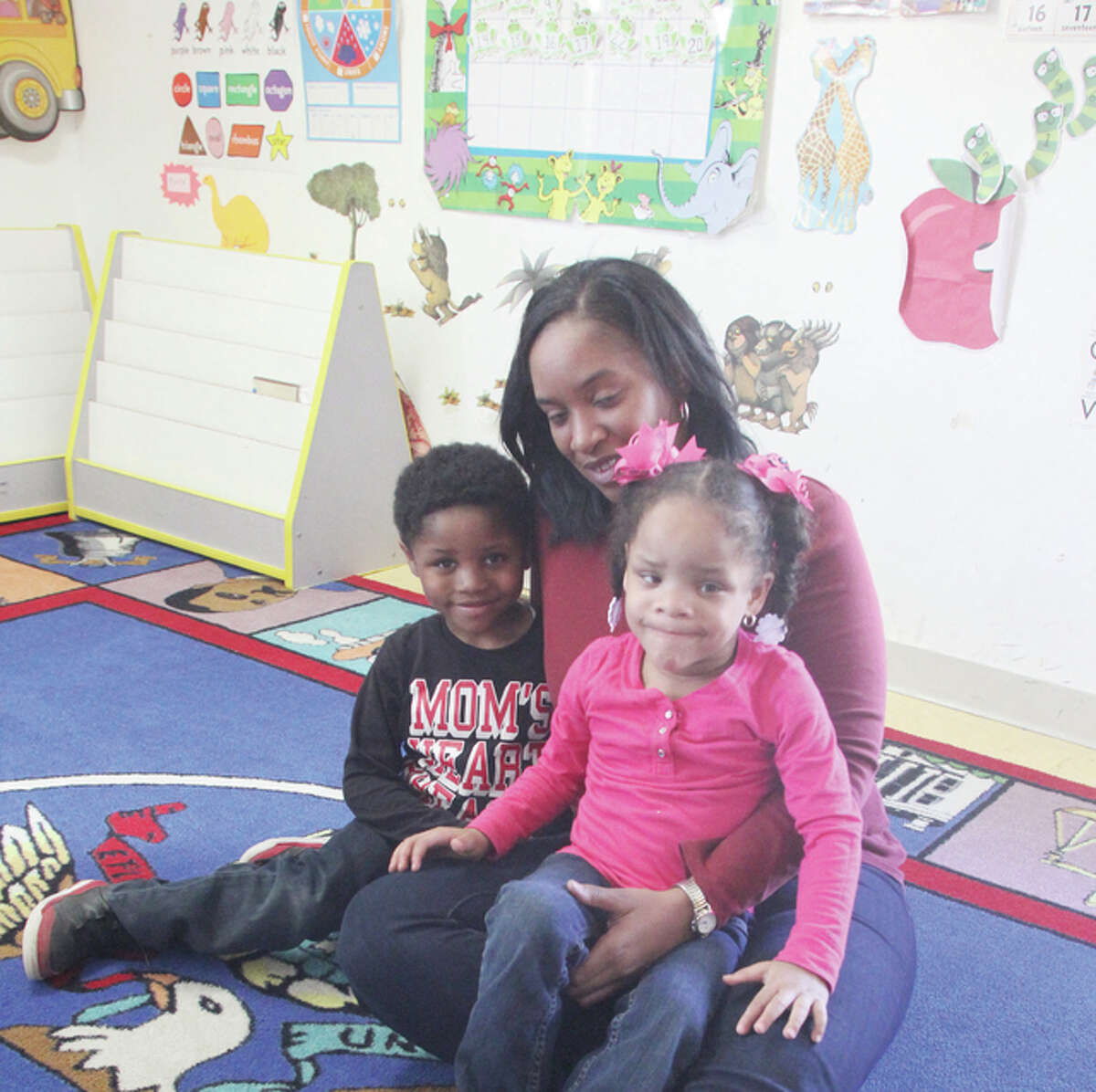 McCarter and her children in a classroom at Maxine’s Day Care Center in Alton.