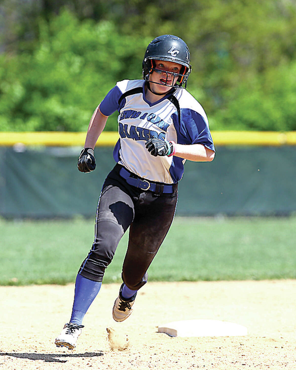 LCCC's Emily Haarmann rounds second base on an RBI triple during the seventh inning of Saturday's game against Lincoln Land in Godfrey. Billy Hurst - For the Telegraph