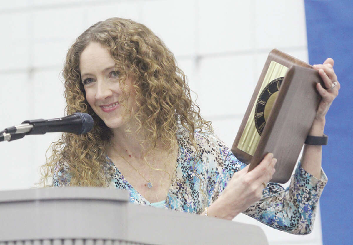 Jersey Community High School teacher Angela Wood shows off her 2016 Silver Medallion Teacher of the Year Award at the 28th annual Silver Medallion Academic Excellence Awards Banquet, held Thursday at Lewis and Clark Community College.
