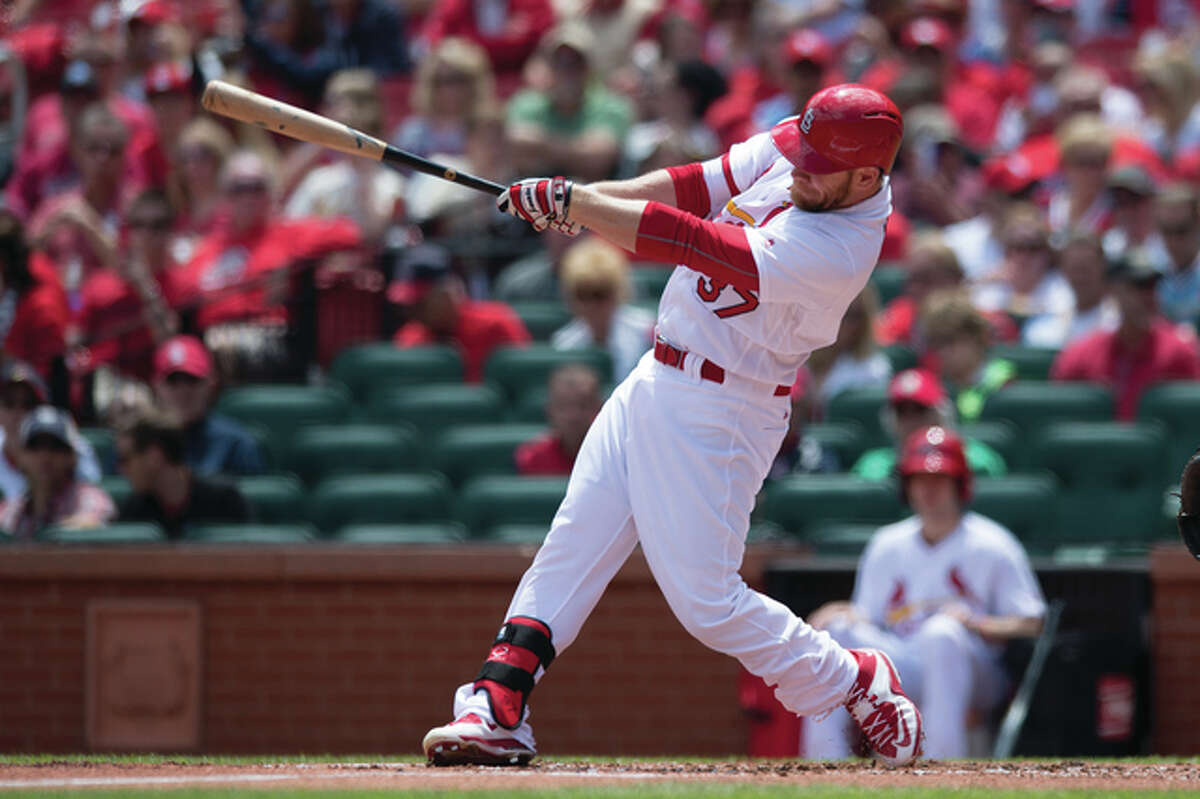 The Cardinals’ Brandon Moss hits a home run in the first inning against the Philadelphia Phillies Sunday at Busch Stadium. The homer was the longest by a left-hander in the stadium’s history.