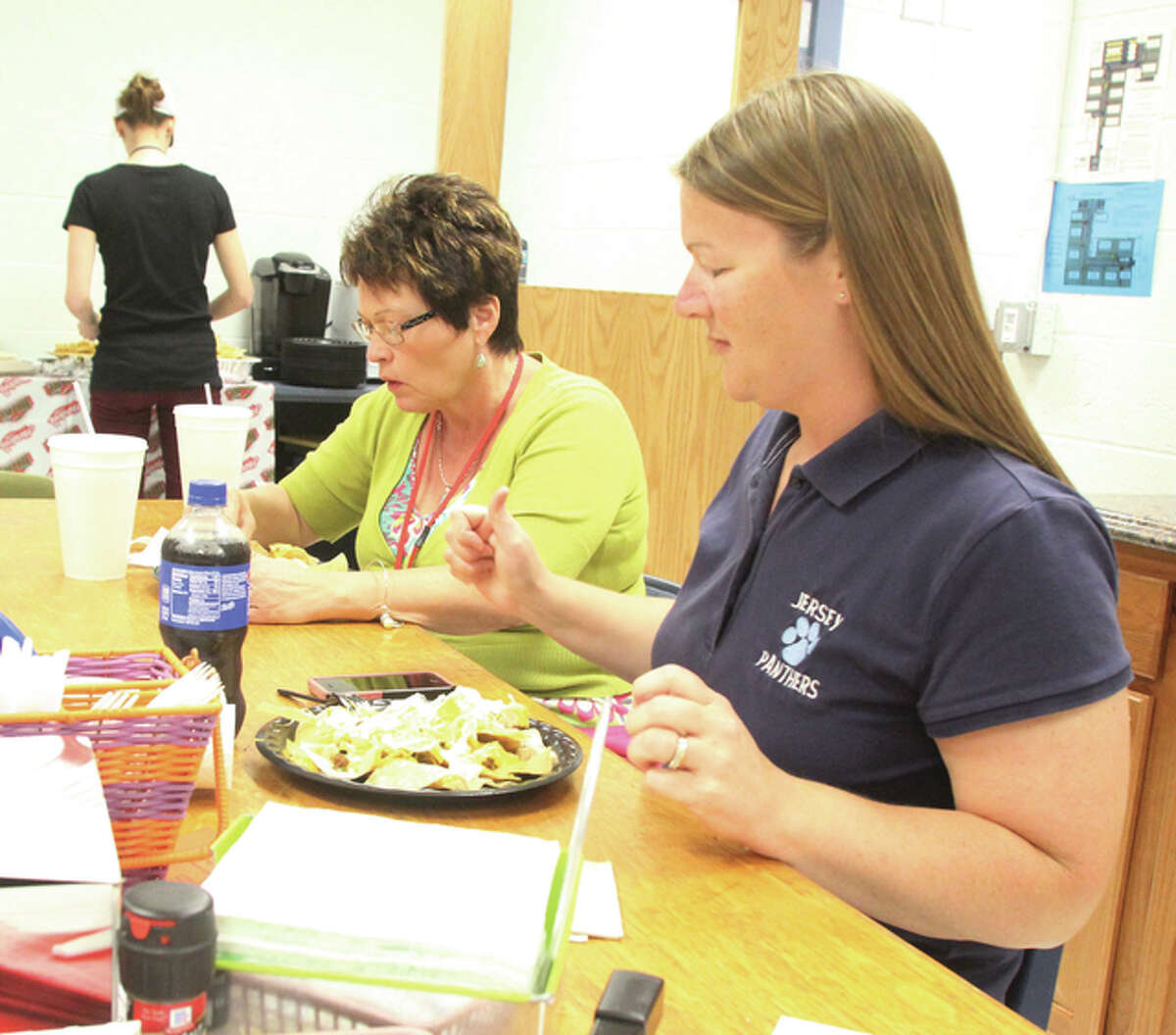 Barbara Smith, right, and Dorothy Wuellner, both second-grade teachers at Jerseyville East Elementary School, eat a taco bar lunch Friday as part of Teacher Appreciation Week. Schools throughout the area have been honoring and celebrating teacher, with breakfast, lunch and treats a common theme.