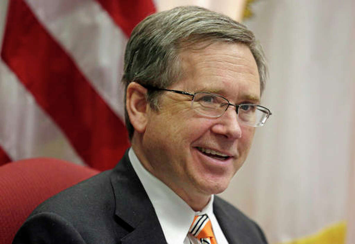 In this June 9, 2014, file photo, U.S. Sen. Mark Kirk R-Ill., speaks in his office in Chicago. Kirk said Tuesday that Donald Trump’s comments about a U.S. federal judge of Mexican heritage are un-American and he cannot support the presumptive presidential nominee. His statement is a reversal for Kirk, one of the most endangered Republican incumbents, who has said previously he would support Trump.