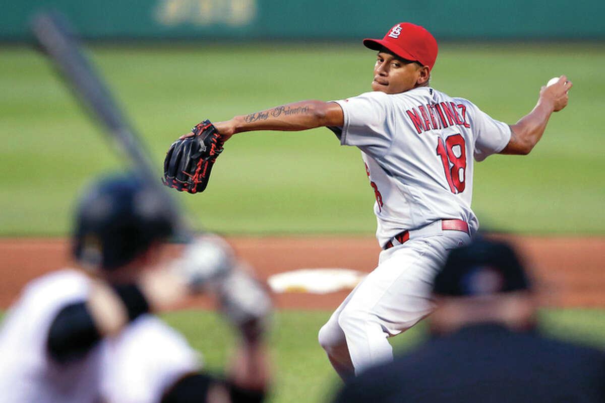 Cardinals pitcher Carlos Martinez delivers in the fifth inning Saturday night against the Pirates in Pittsburgh.