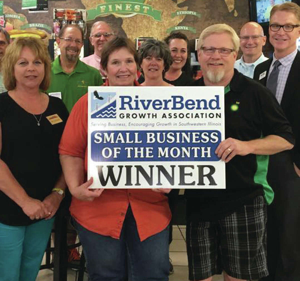 Owners Jim and Patty Eppel pose with members of the RiverBend Growth Association. Their business, Eppel’s Pantry and Deli, won the association’s Business of the Month award in June.