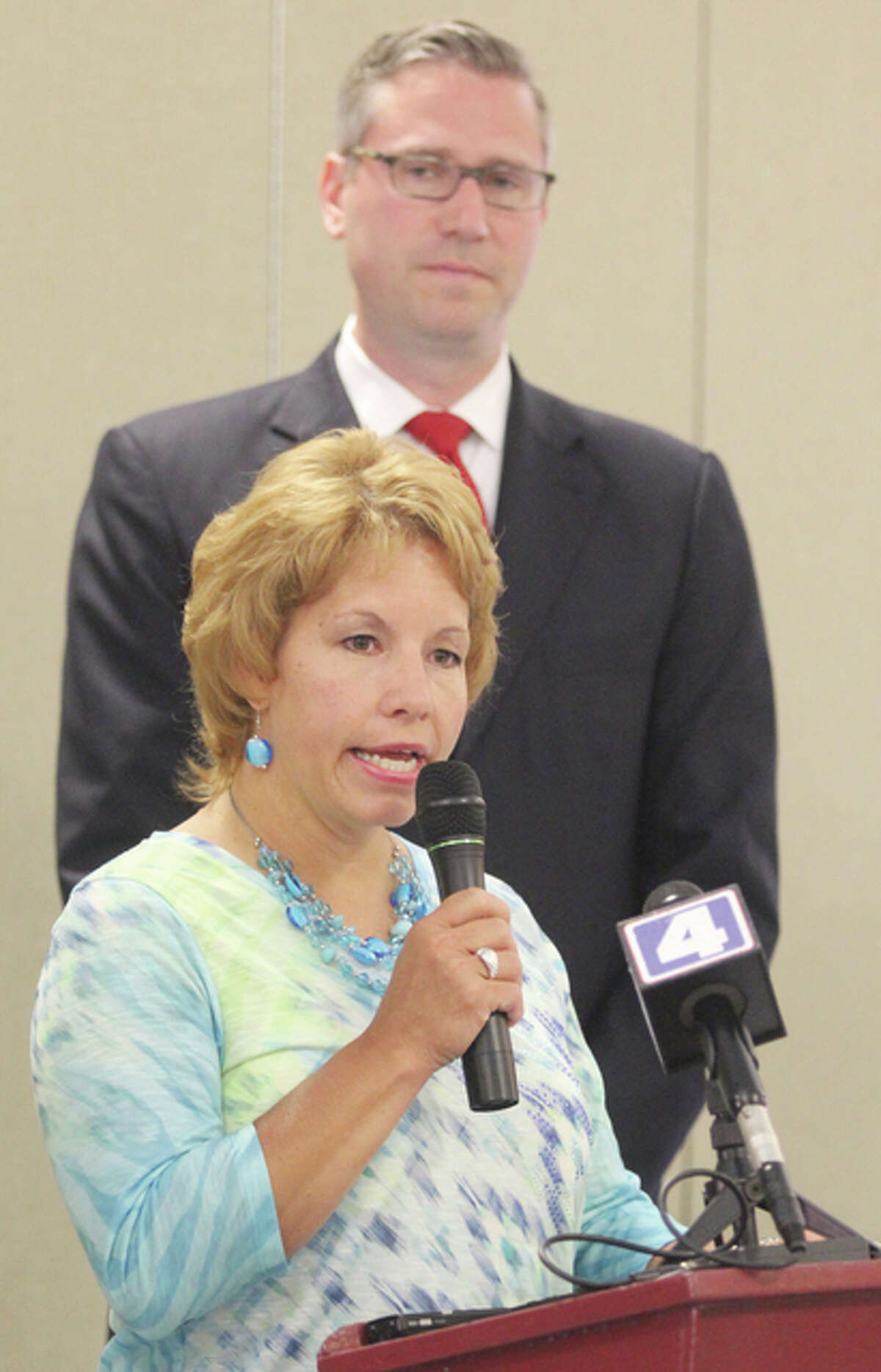 Sherry Mayberry, of Wood River, speaks at a press conference Thursday morning at Senior Services Plus in Alton, as Illinois Treasurer Michael Frerichs looks on. He was in town to encourage Gov. Bruce Rauner to sign HB 4633, which requires insurers to use the federal Death Master File to determine if a policy holder has died and the death benefits have not been paid.
