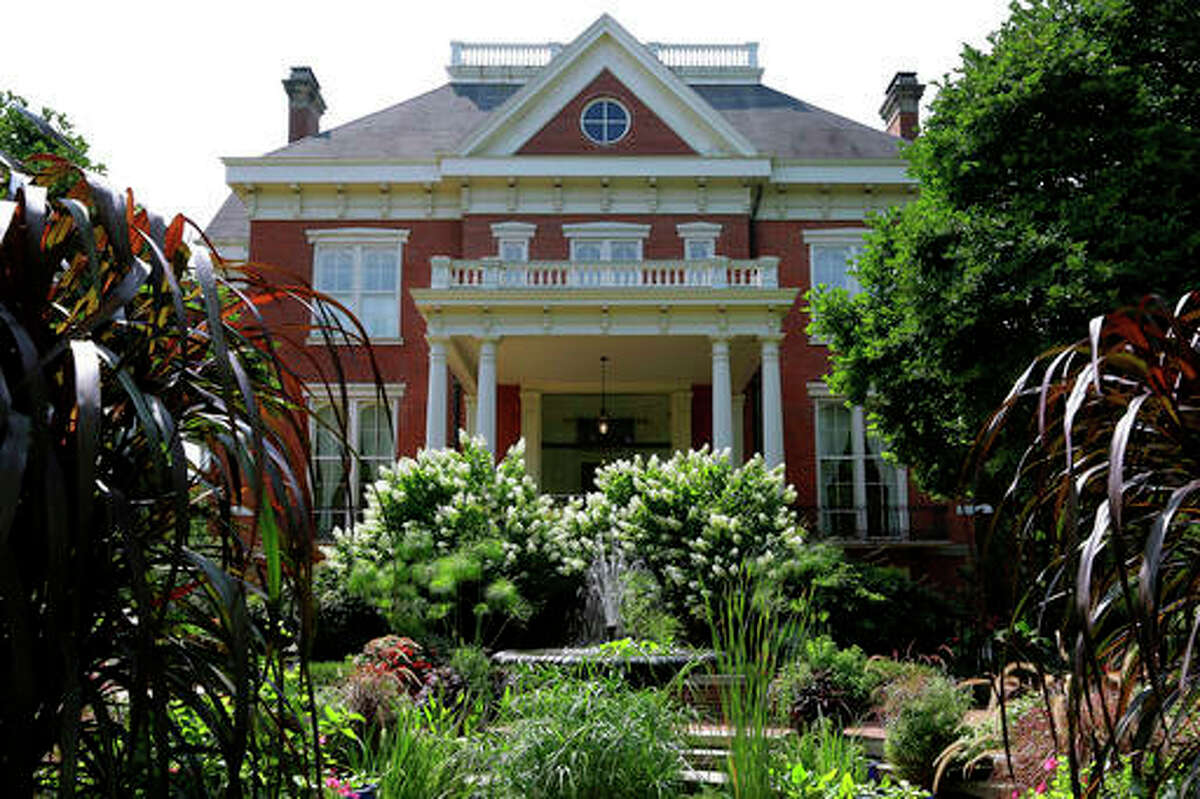 In this Aug. 28, 2014, file photo, landscaping is maintained at the Illinois Executive Mansion in Springfield, Illinois. An agreement shows that a privately funded renovation of the Illinois Executive Mansion in Springfield will follow wage and bidding rules required of traditional taxpayer-funded construction projects.