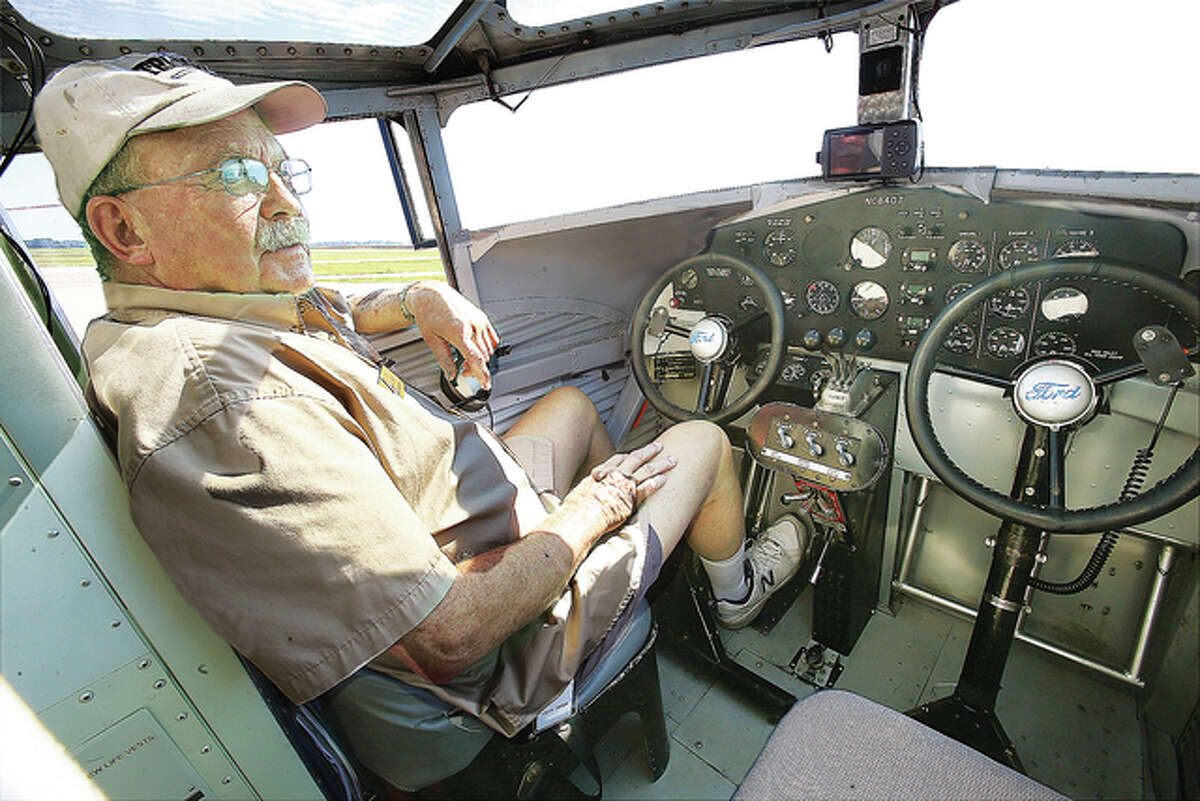 Ford Tri-Motor pilot Ed Rusch sits behind the controls of the aircraft before a media flight Thursday. The plane will available to look at and fly in, for a fee, through this weekend at St. Louis Regional Airport in Bethalto.