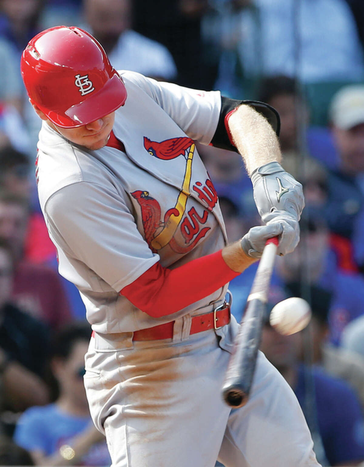 The Cardinals’ Stephen Piscotty hits a RBI single against the Cubs during the eighth inning Saturday in Chicago.
