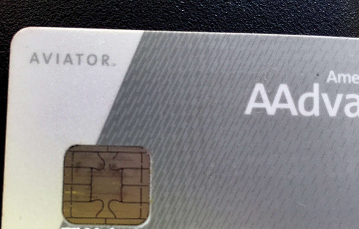 A card with one of the new metallic chips embedded is shown. Businesses were recently made to switch their point-of-sale systems to accept the new, chipped cards.