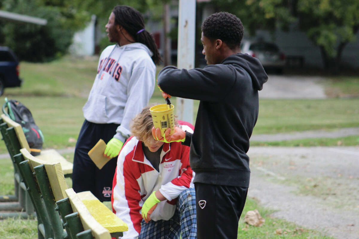 The Alton High School Redbirds football team helped clean up James H. Killion Park at Salu by painting, mulching and weeding. The Redbirds’ head coach Eric Dickerson and Alton Mayor Brant Walker accompanied the team Saturday morning.