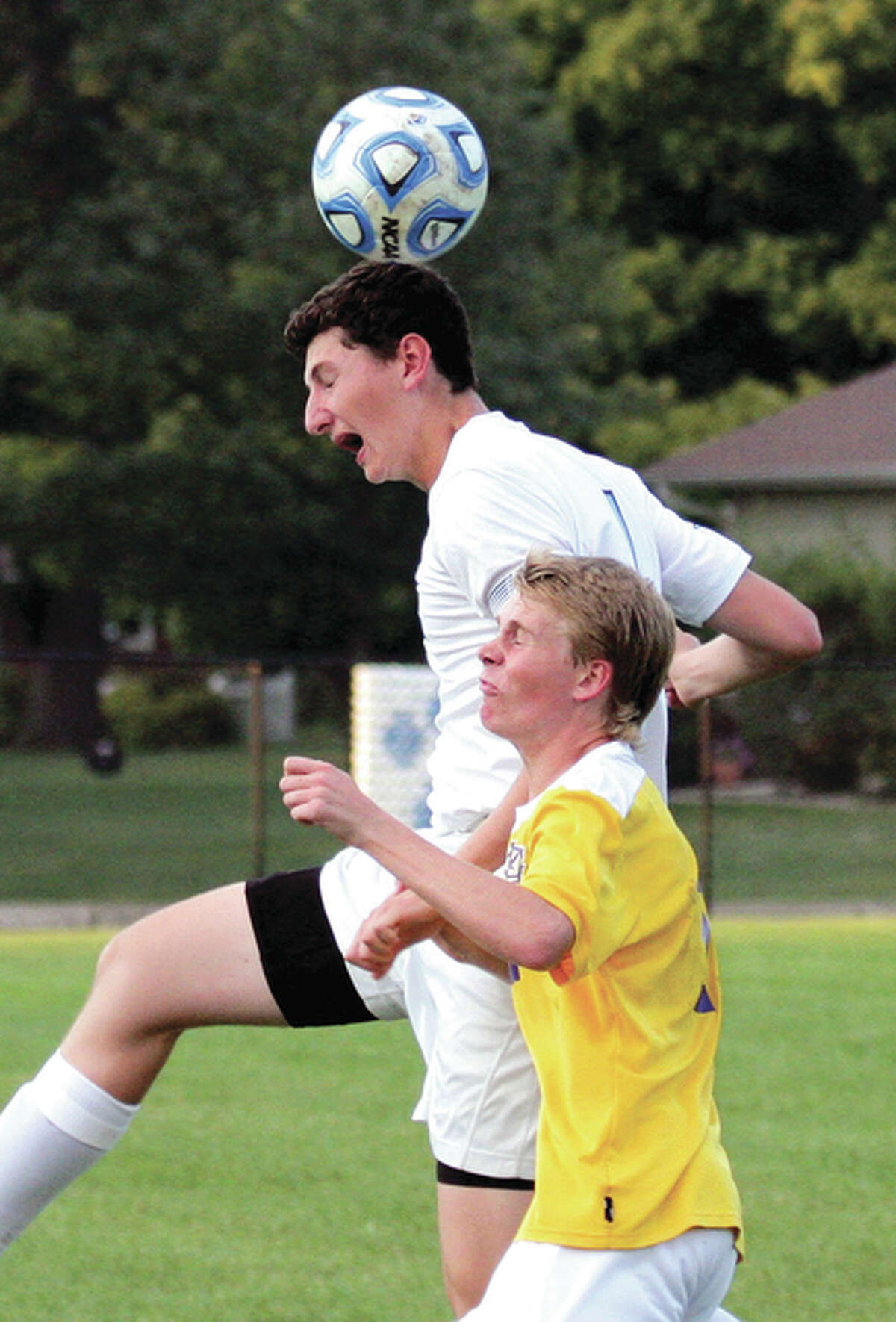 Jersey’s Drake Kanallakan (back) goes up to head the ball over Civic Memorial’s Trevor Panyik in a Panthers win Sept. 17 in Jerseyville. The Panthers were on the road Monday in Alton and picked up a 1-0 win over the Redbirds to extend their winning streak to five in a row.