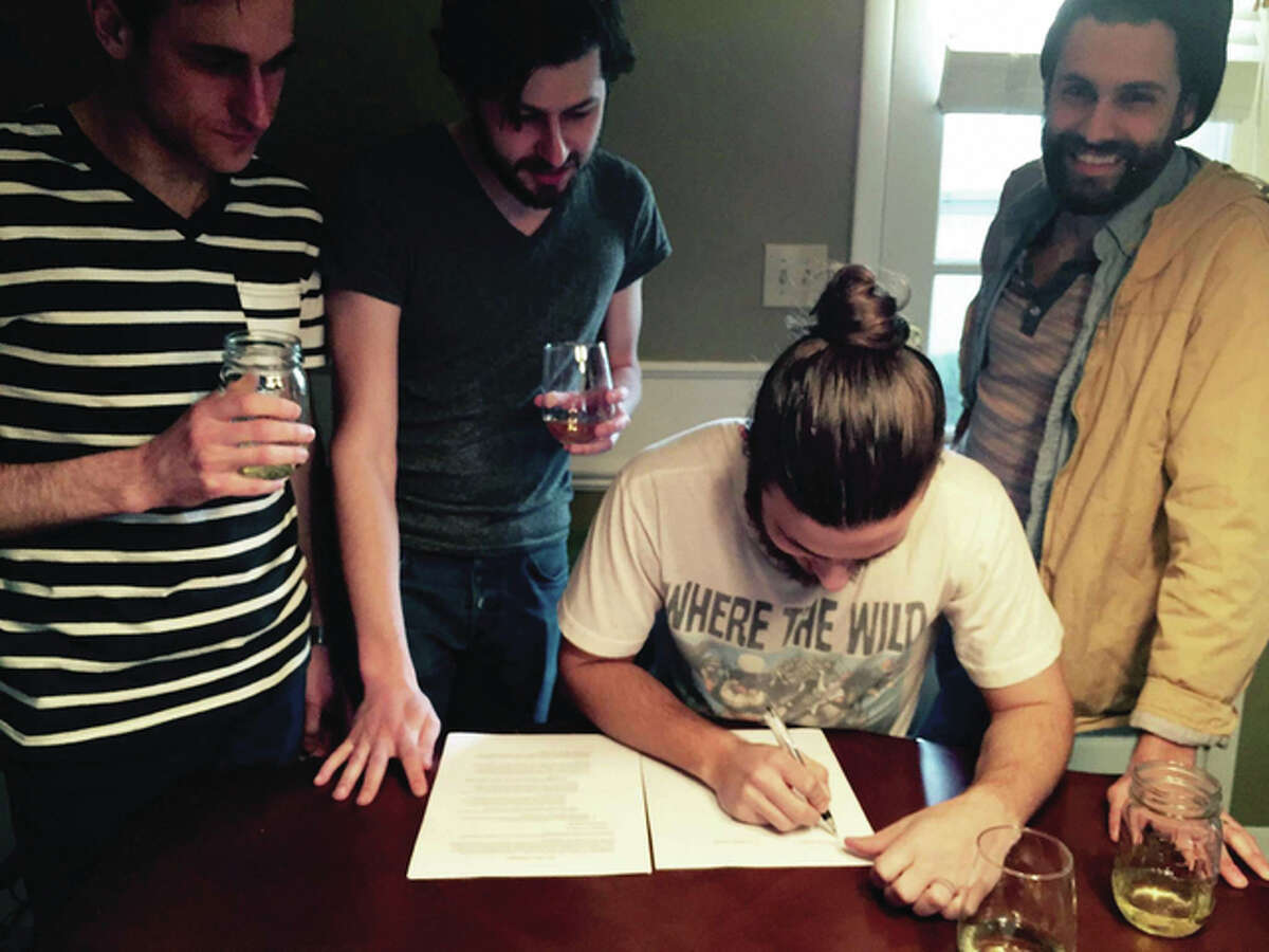 After nearly six hears of hard work touring, Cleveland-based alternative band The Lighthouse and the Whaler signs its first record contract.