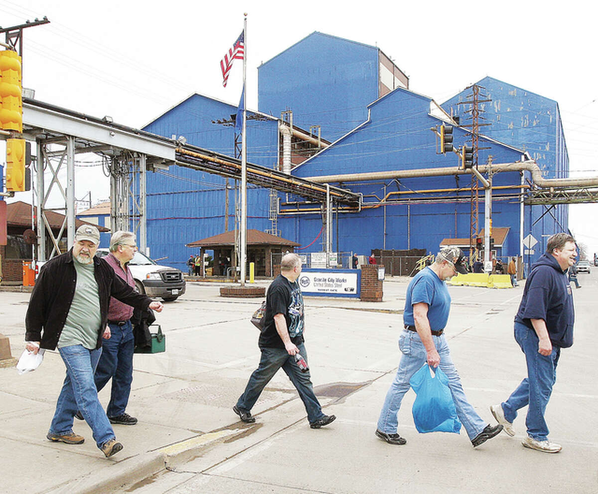 Workers leave the Nash Street gate of United States Steel’s Granite City Works in March of this year when they were last threatened with a shutdown caused by the company’s desire to consolidate it’s North American flat-rolled steel operations. The company has again notified the Granite City plants 2,000 workers that operations there may be idled for the same reason.