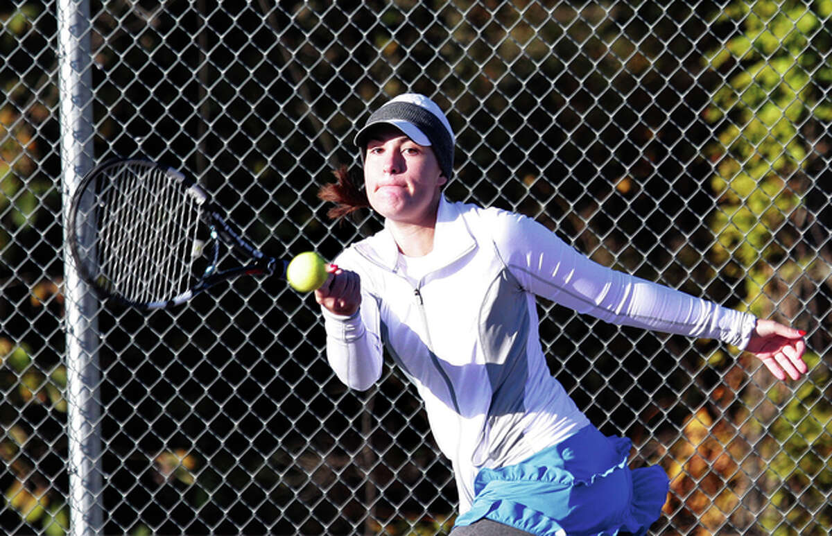 Marquette Catholic sophomore Shelby Jones hits a shot Saturday at the Alton Sectional, where Jones placed third in singles to earn her second straight trip to state.