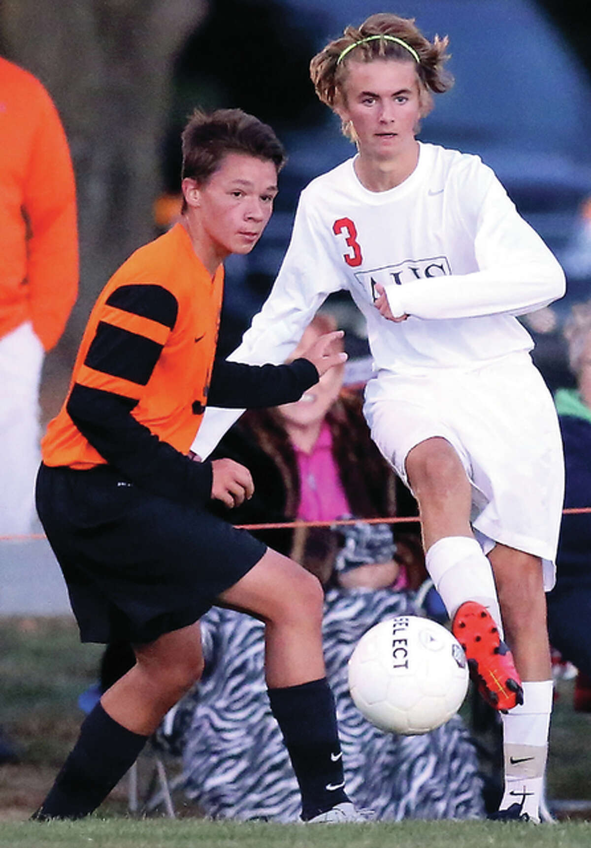 Alton’s Adam Kane (right) and Edwardsville’s Kyle Wright, shown in a Redbirds victory Oct. 1 in Alton, joined their teams in Class 3A regional soccer play Tuesday with Alton at Quincy and Edwardsville on its home field.