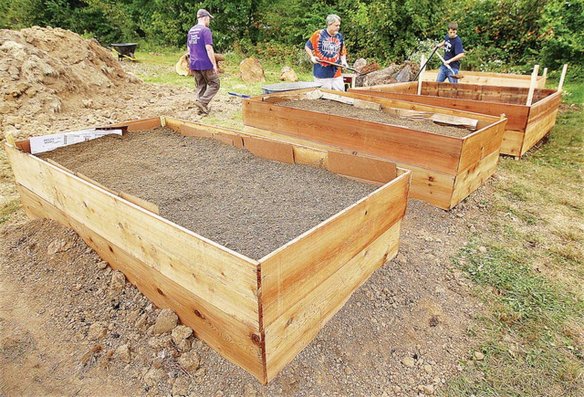 The new boxes, which next season will grow a variety of vegetables, are deeper than the ones the center currently uses nearby.