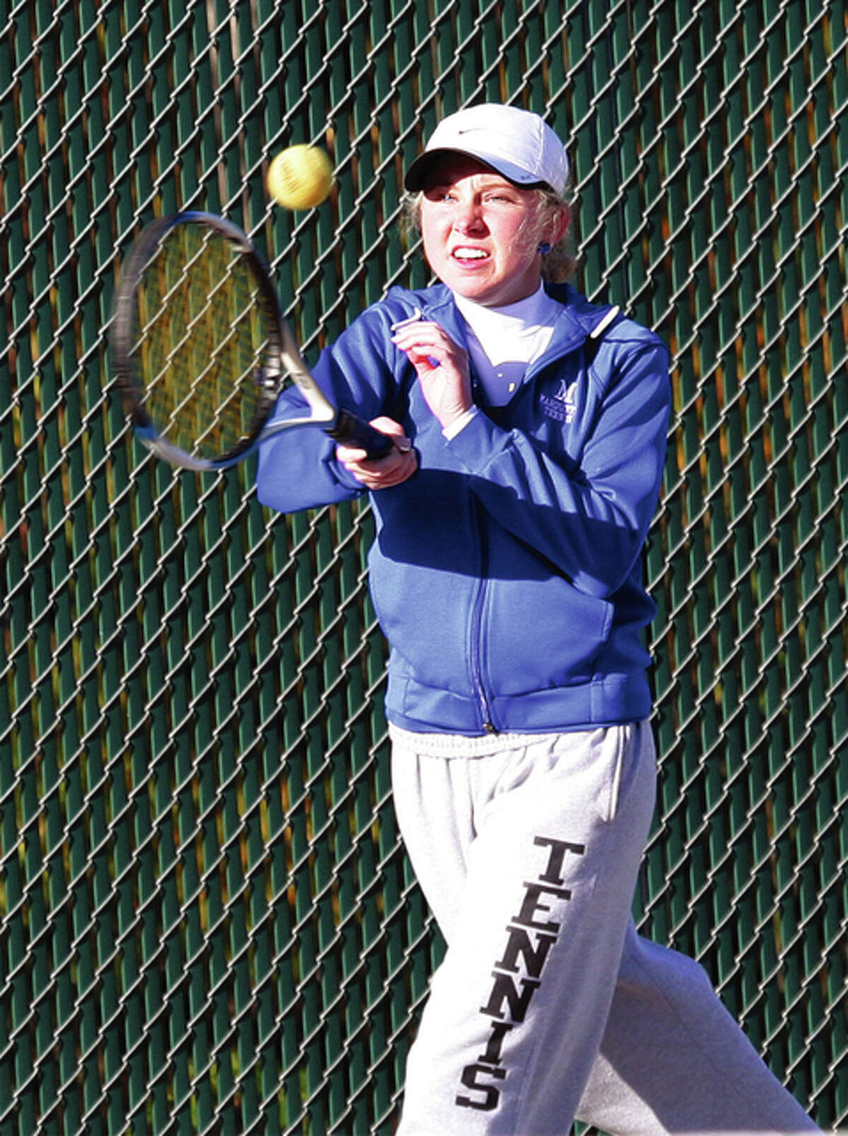 Marquette Catholic senior Elena Gable hits a shot during a semifinal doubles match Saturday morning at the Alton Sectional at the AHS courts in Godfrey. Gable and doubles partner Laura Moore open state tourney play Thursday in Buffalo Grove.