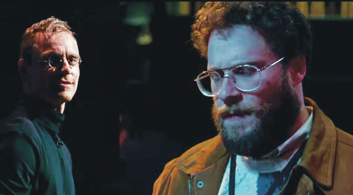 Michael Fassbender, left, stars as Steve Jobs and Steve Wozniak, who co-founded Apple, is played by Seth Rogen, right, in the biopic “Steve Jobs.”
