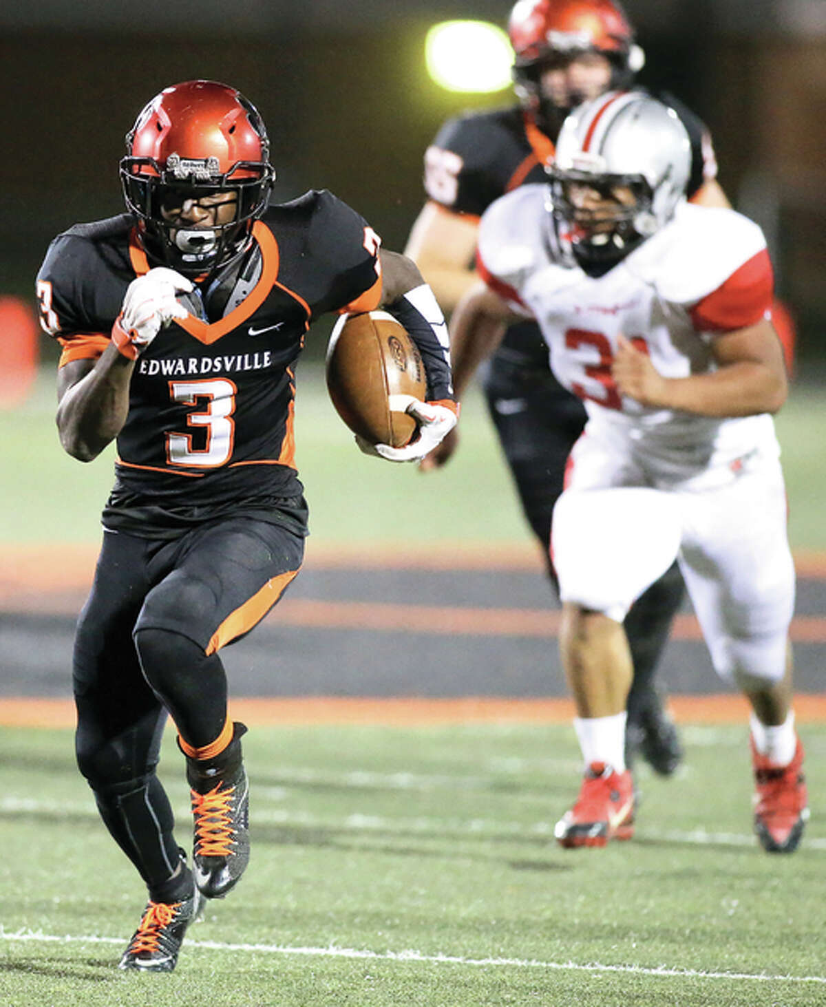 Edwardsville’s Kendell Davis (3) heads for the end zone on a touchdown during the second quarter against Alton last Friday at the District 7 Sports Complex in Edwardsville. The Tigers won 45-0 and head to Granite City on Friday looking to complete their seventh 9-0 regular season in the last 20 years.