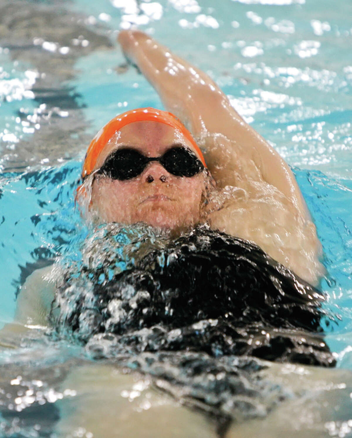 Edwardsville’s Elizaebth McPherson finished first the 100-yard backstroke in her team’s recent win over O’Fallon.