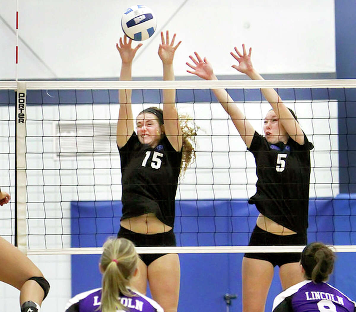 LCCC’s Bailey McGuire, left, a freshman from Roxana, and teammate Denae White, a freshman from New Athens, go up at the net during Region 24 Tournament action against Lincoln Wednesday at LCCC. The Trailblazers won and will take on No. 1-ranked Parkland in the semifinals Saturday at Lincoln Land CC in Springfield.