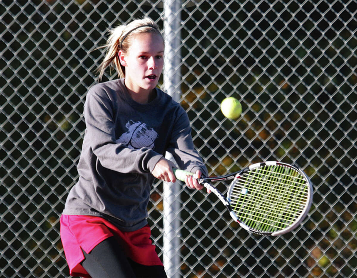Roxana junior Sydney Owsley hits a backhand during a semifinal match against Edwardsville’s Callaghan Adams at the Alton Sectional on Oct. 17. Adams won the match 6-0, 6-0, but Owsley advanced from the sectional to win three matches at the state tournament. With the expansion to two classes in 2016, opportunities for Owsley and other small-school players figure to increase.