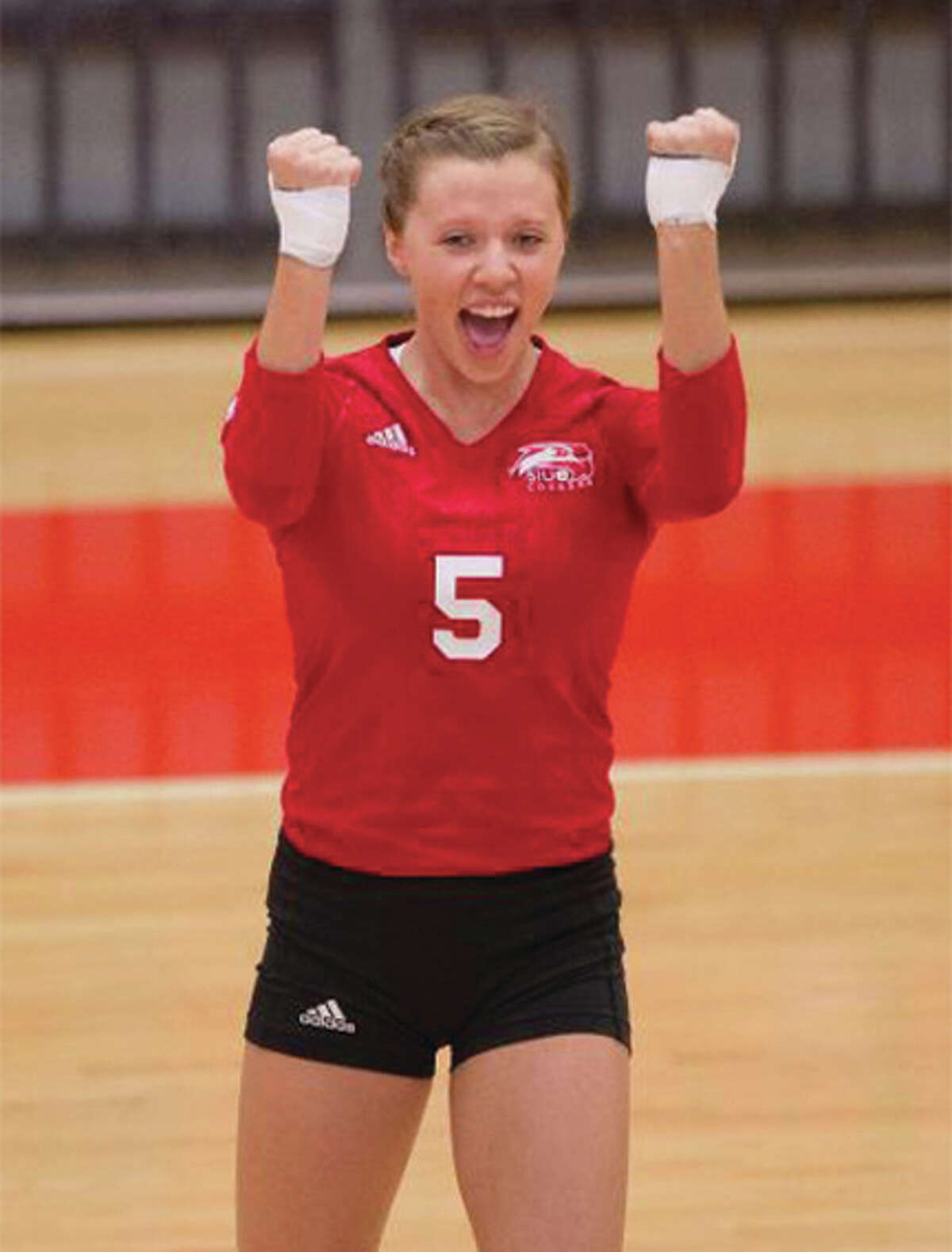 SIUE sophomore middle blocker Carley Ramich celebrates a point during the Cougars’ four-set OVC victory over Belmont on Saturday at Vadalabene Center in Edwardsville.