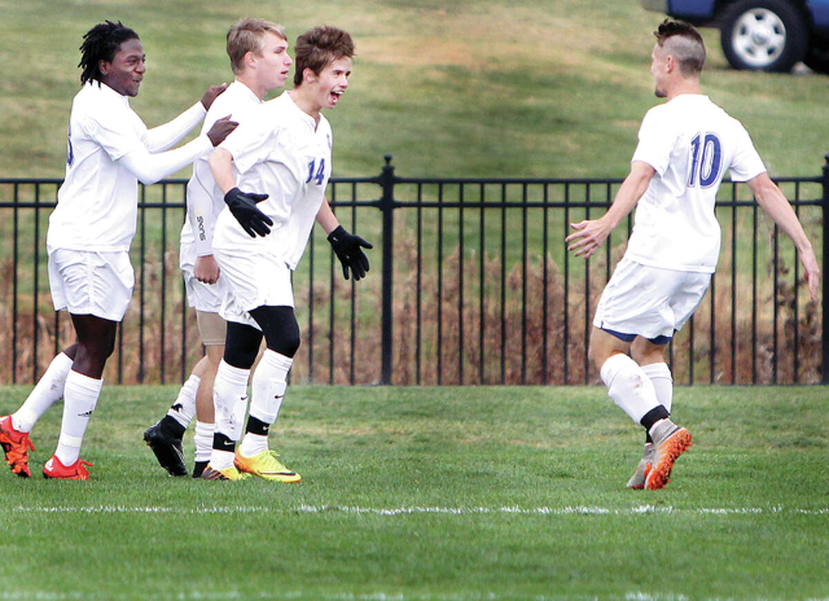 From left, LCCC’s Markell Stadler, Blake Cearns, Michael Toolen and Lochlan Reus celebrate a goal in their Region 24 tourney title game win over Illinois Central.