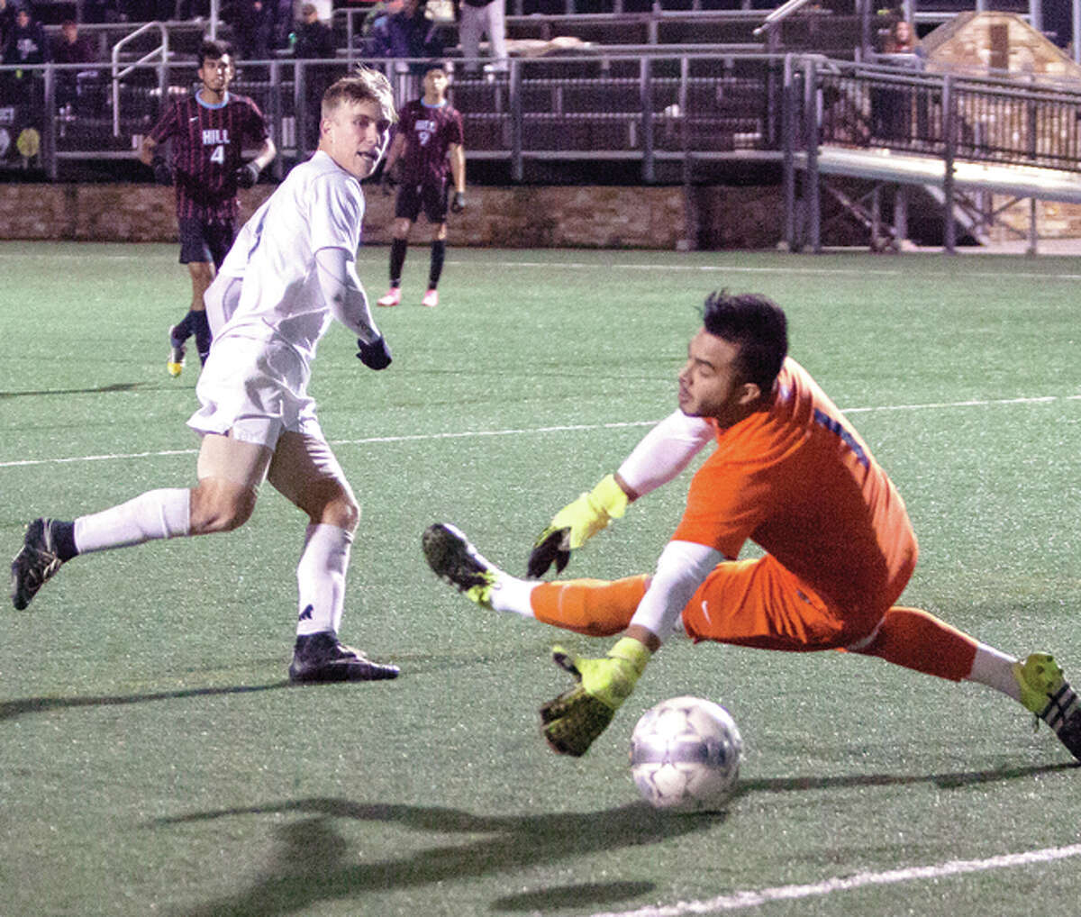 Lewis and Clark’s Blake Cearns slips the ball past Hill College goalie Josh Nieto in sudden-death overtime Tuesday, lifting the Trailblazers to a 2-1 win at the NJCAA National Tournament in Martinsville, Va.