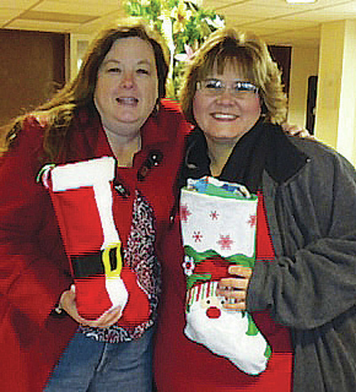 A pair of colleagues and most importantly — friends — Foxes Grove of Wood River’s Stacey Noble-Loveland, left, Glenhaven Gardens of Alton’s Laura Robinson, right, started Stockings for Seniors last year over breakfast. Now they are in the process of collecting for this year’s second annual Stockings for Seniors.