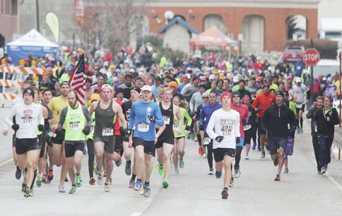 Participants in the 56th Annual Great River Road Run start the 10-mile run Saturday morning in Alton. More than 700 people participated in the annual event, which offered both 10- and 2-mile runs.