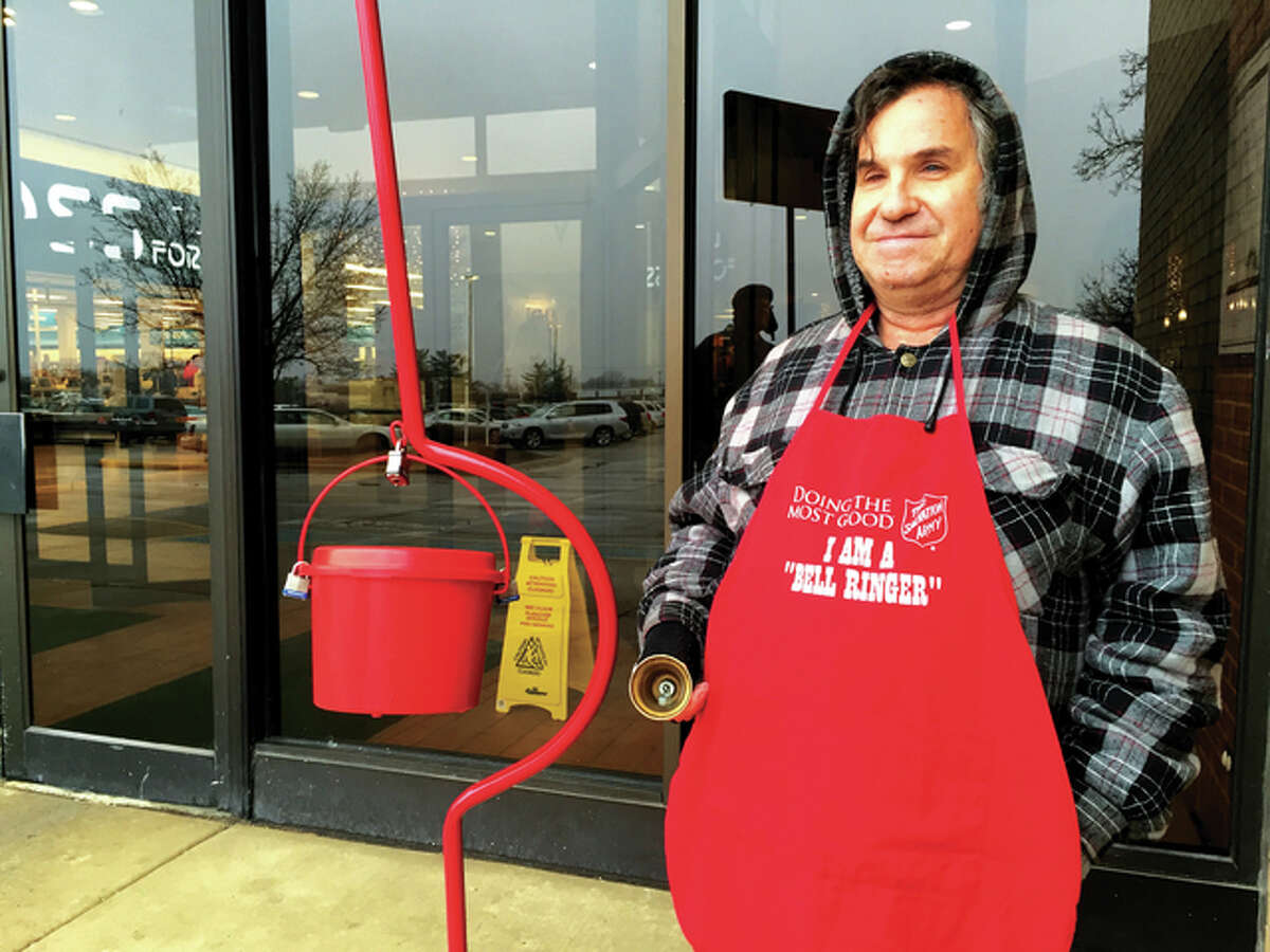 Salvation Army volunteer Dane Rockafellow rings his bell Friday morning at Alton Square Mall. He said there seems to be fewer shoppers this year.