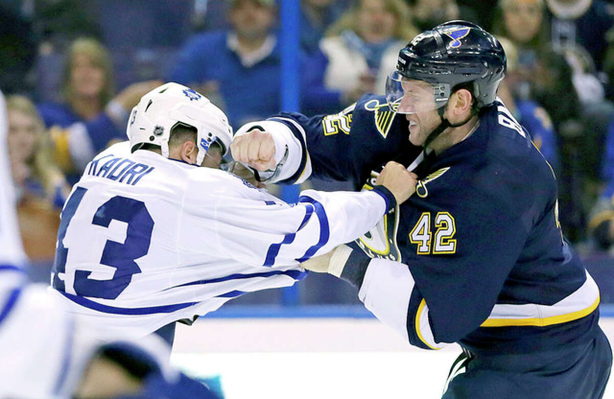 The Blues’ David Backes (42) fights with Toronto Maple Leafs’ Nazem Kadri in the second period of Saturday night’s NHL game in St. Louis.