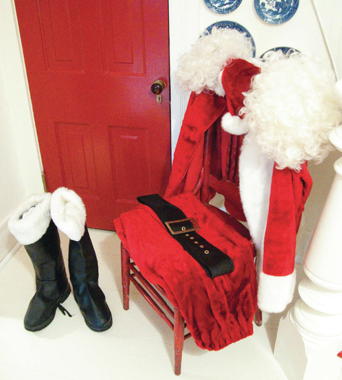 Cathy and Randy Marmino, whose 1881 historic farm house located at 705 S. Moreland Road, has been featured in a number of national magazines, had a Santa suit with boots on display which drew a lot of attention from those touring the home.