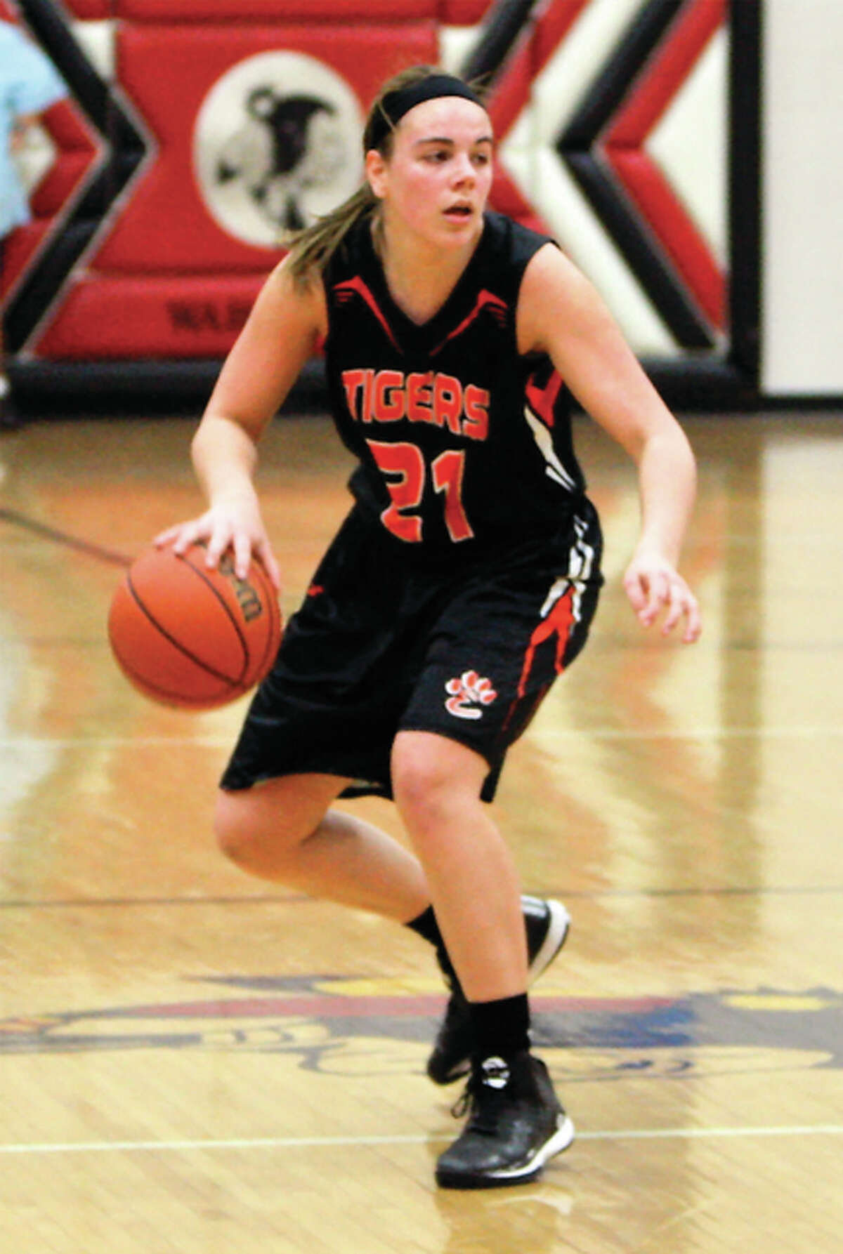 Edwardsville’s Rachel Pranger, shown handling the basketball during a Class 4A sectional semifinal victory at Granite City, is one of four starters back from last season’s 30-1 Tigers team.